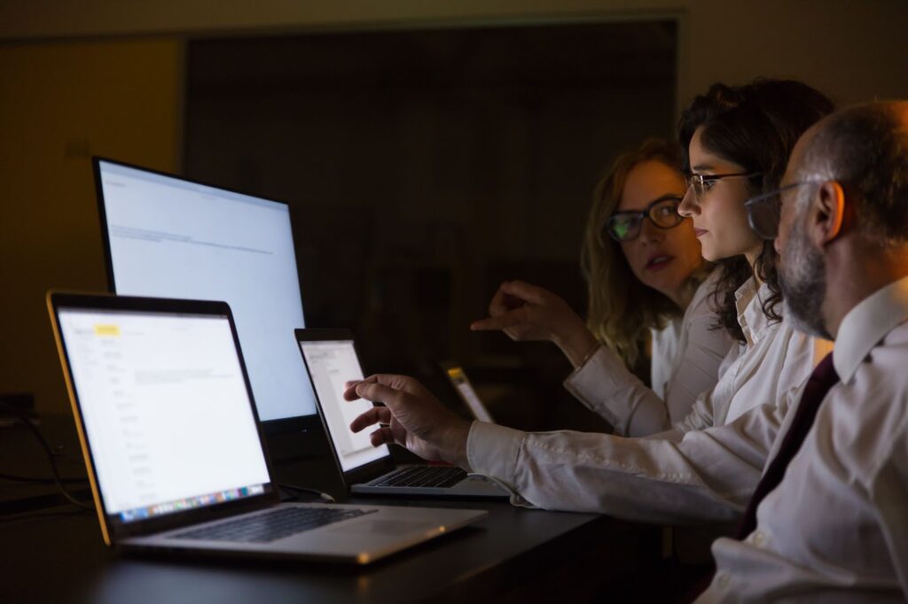 Business people discussing work in dark office